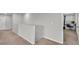 Upstairs hallway with carpet, showing access to bedrooms and office at 5528 Arlington River Dr, Lakeland, FL 33811