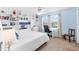 Bedroom with built-in shelving, a workspace, and a large window at 1920 E Edgewood Dr # G5, Lakeland, FL 33803