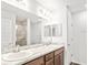 Double vanity bathroom with a shower and modern finishes at 631 Bentley North Dr, Auburndale, FL 33823