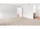 Bright and airy bedroom with carpet flooring and access to bathroom at 631 Bentley North Dr, Auburndale, FL 33823