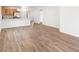 Open living area with hardwood floors and kitchen bar at 631 Bentley North Dr, Auburndale, FL 33823
