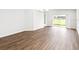 Spacious living room featuring a sliding glass door and hardwood floors at 631 Bentley North Dr, Auburndale, FL 33823