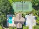 Birds-eye view of a clubhouse, pool, and tennis court available in the community at 665 Lake Clark Pl, Lakeland, FL 33813