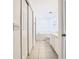 En-suite bathroom with double sinks, tiled flooring, and bright, white walls at 665 Lake Clark Pl, Lakeland, FL 33813