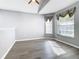 Spacious empty room with gray walls, vaulted ceilings, and luxury vinyl flooring; awaiting personal touches and decor at 665 Lake Clark Pl, Lakeland, FL 33813