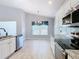 Bright eat-in kitchen features modern appliances, tile floors, and granite countertops at 665 Lake Clark Pl, Lakeland, FL 33813
