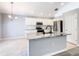 Kitchen island with stainless steel appliances and granite countertops, great for entertaining at 665 Lake Clark Pl, Lakeland, FL 33813