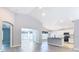 Open living space showcasing gray walls, modern flooring, a seamless transition to the kitchen, and lots of light at 665 Lake Clark Pl, Lakeland, FL 33813