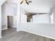 Open living space with high ceilings, neutral paint, modern flooring, and a half wall separating spaces at 665 Lake Clark Pl, Lakeland, FL 33813