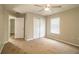 Bright bedroom featuring ceiling fan and large closet at 3926 Rollingsford Cir, Lakeland, FL 33810