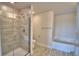 Bathroom featuring a glass-enclosed shower, toilet, and tub, offering a relaxing space at 4538 Grandview Glen Dr, Auburndale, FL 33823
