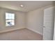 Bedroom with neutral paint, carpet, window for natural light and a walk-in closet at 4538 Grandview Glen Dr, Auburndale, FL 33823