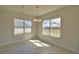 Bright dining area featuring wood-look tile floors, classic trim, and plenty of natural light from the oversized windows at 4538 Grandview Glen Dr, Auburndale, FL 33823