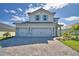 Charming two-story home with a three-car garage and a brick driveway at 4538 Grandview Glen Dr, Auburndale, FL 33823