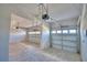 Three car garage showing all automatic doors with room for vehicles and storage space for tools and other items at 4538 Grandview Glen Dr, Auburndale, FL 33823