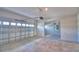Spacious three car garage with concrete flooring and plenty of room for storage at 4538 Grandview Glen Dr, Auburndale, FL 33823