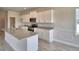 Modern kitchen with granite countertops, white cabinetry and stainless steel appliances at 4538 Grandview Glen Dr, Auburndale, FL 33823