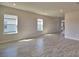 Bright and spacious living room featuring modern tile flooring, recessed lighting, and plenty of natural light at 4538 Grandview Glen Dr, Auburndale, FL 33823