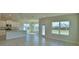 Spacious living area featuring an open floor plan, tile flooring, bright windows, and modern finishes at 4538 Grandview Glen Dr, Auburndale, FL 33823