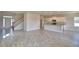 Spacious living space showcasing an open floor plan with tile and an adjacent kitchen at 4538 Grandview Glen Dr, Auburndale, FL 33823