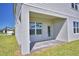 Covered patio with brick floor, windows and a door at 4538 Grandview Glen Dr, Auburndale, FL 33823