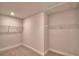 Walk-in closet with carpet flooring and shelving unit at 4538 Grandview Glen Dr, Auburndale, FL 33823