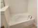 Clean white bathtub, set in a tiled bathroom at 4544 Grand View Glen Dr, Auburndale, FL 33823
