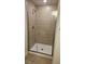 Tiled walk-in shower with glass enclosure at 4544 Grand View Glen Dr, Auburndale, FL 33823