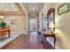 Hardwood floors and elegant entryway with a view to the dining room at 6021 Stoney Creek Pl, Lakeland, FL 33811