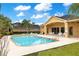 Community pool with lounge chairs and patio at 6021 Stoney Creek Pl, Lakeland, FL 33811