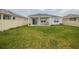 Aerial view of backyard with grassy lawn and home at 296 Spirit Landings Cir, Winter Haven, FL 33880