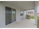 Covered patio with grill and sliding glass door access at 296 Spirit Landings Cir, Winter Haven, FL 33880