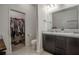 Bathroom boasts double vanity, walk-in closet, and toilet at 296 Spirit Landings Cir, Winter Haven, FL 33880