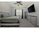 Spacious bedroom with large bed, dresser, and TV at 296 Spirit Landings Cir, Winter Haven, FL 33880