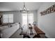 Bright dining room featuring a rustic wooden table and chandelier at 296 Spirit Landings Cir, Winter Haven, FL 33880