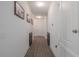Clean and bright hallway with wood-look flooring at 296 Spirit Landings Cir, Winter Haven, FL 33880