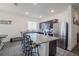 Kitchen with island, stainless steel appliances, and granite counters at 296 Spirit Landings Cir, Winter Haven, FL 33880