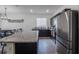Kitchen with stainless steel fridge and granite island at 296 Spirit Landings Cir, Winter Haven, FL 33880