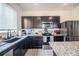 Kitchen with corner sink, granite counters, and island at 296 Spirit Landings Cir, Winter Haven, FL 33880