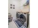 Laundry room with washer, dryer, and ample shelving at 296 Spirit Landings Cir, Winter Haven, FL 33880