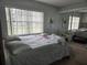 Cozy bedroom with large window and closet with mirrored doors offering plenty of light and storage at 462 Cameo Dr # 462, Lakeland, FL 33803