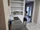 Butler's pantry with open shelving, counter space, and view to the dining area at 462 Cameo Dr # 462, Lakeland, FL 33803