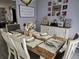 Dining room with wood table, seating for six, and decor at 462 Cameo Dr # 462, Lakeland, FL 33803