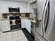 Kitchen with stainless steel appliances, granite countertops, and white cabinets at 462 Cameo Dr # 462, Lakeland, FL 33803