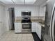 Kitchen featuring stainless steel appliances, granite countertops, and ample cabinet space at 462 Cameo Dr # 462, Lakeland, FL 33803