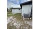 View of the backyard featuring a newer AC system at 602 Taylor Blvd, Winter Haven, FL 33880