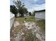 Spacious backyard partially covered in sand at 602 Taylor Blvd, Winter Haven, FL 33880
