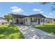 Charming single-story home with a covered carport and a well-maintained lawn at 602 Taylor Blvd, Winter Haven, FL 33880