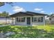 Charming single-story home with a covered carport and a well-maintained lawn at 602 Taylor Blvd, Winter Haven, FL 33880