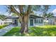 Charming single-story home with a lush front yard and inviting entrance, perfect for families at 602 Taylor Blvd, Winter Haven, FL 33880
